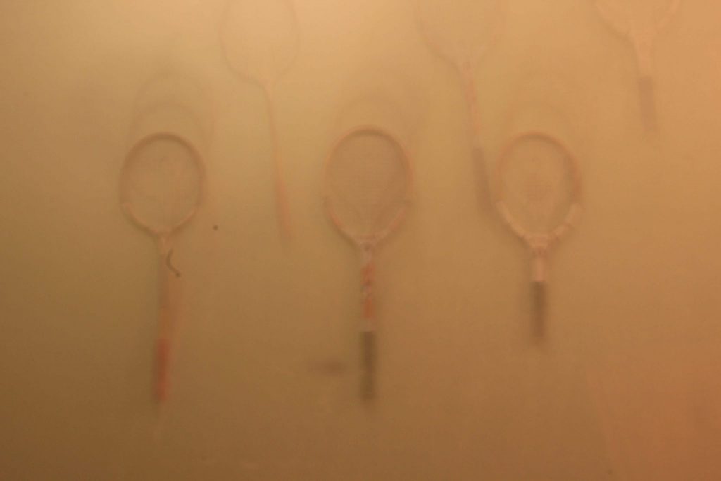 blurry image of tennis rockets