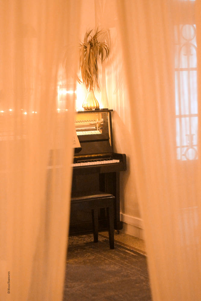 piano through curtain